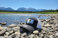 Buglife Fly Goods hat on Montana riverbank - bright