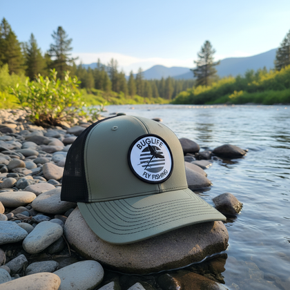 Green hat on Montana riverbank - version 2