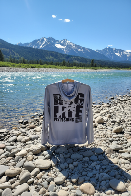 Grundens BFG sun hoodie back upright on Montana riverbank