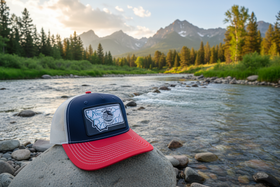 Hat with Red Bill on Montana Riverbank