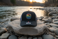 Men's Buglife Fly Goods Hat - Front View on Montana Riverbank